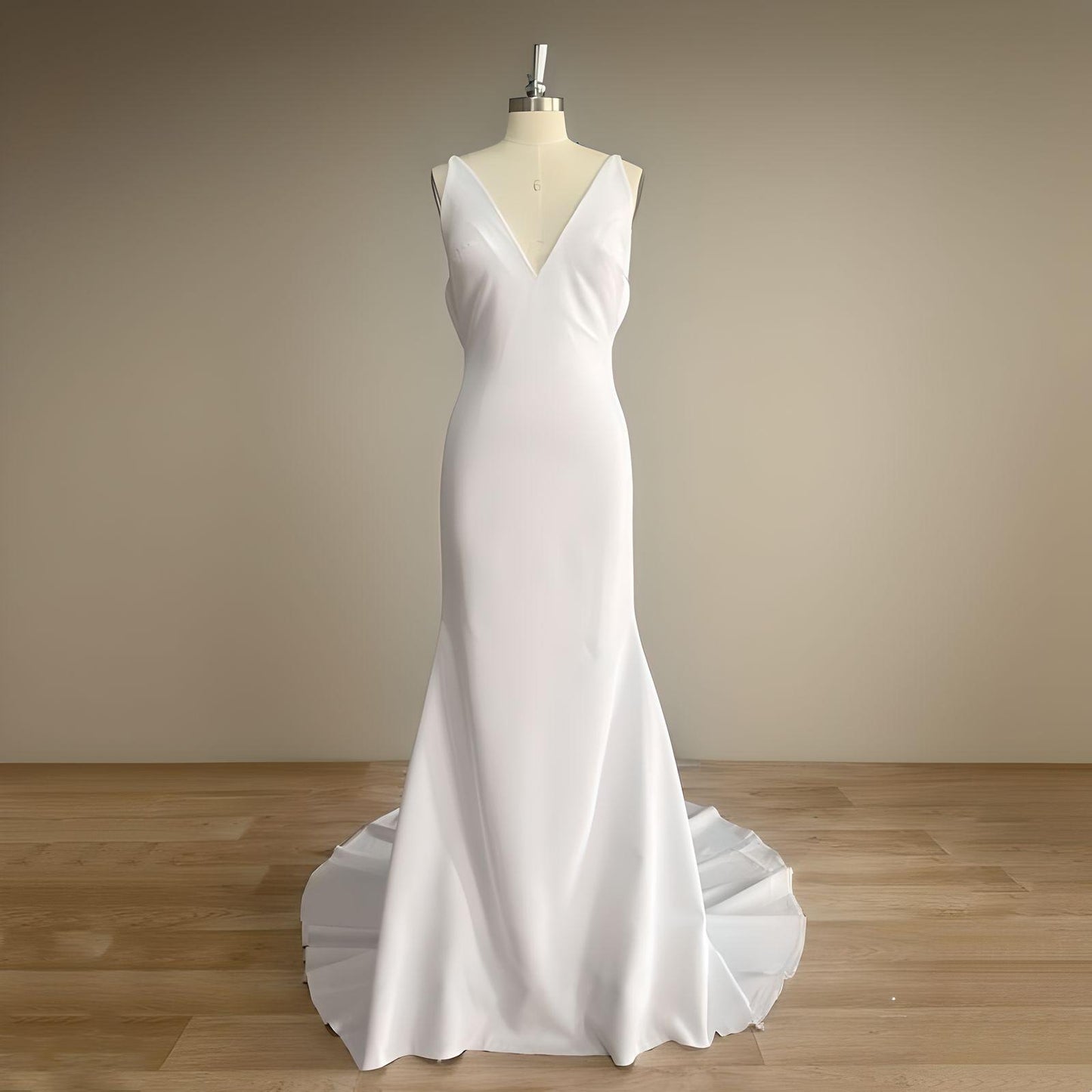 Mannequin in a sleek mermaid wedding dress with a V neckline, designed for a modern and elegant bridal look.