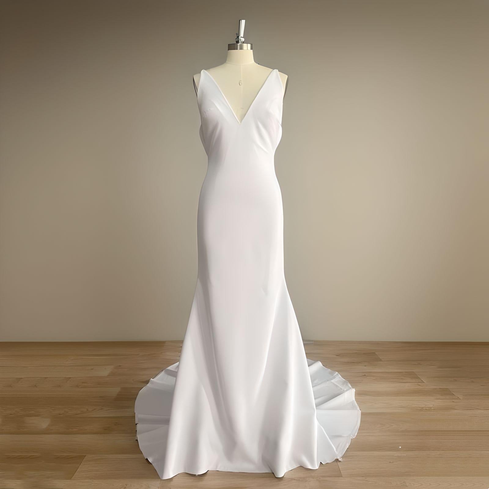 Mannequin in a sleek mermaid wedding dress with a V neckline, designed for a modern and elegant bridal look.