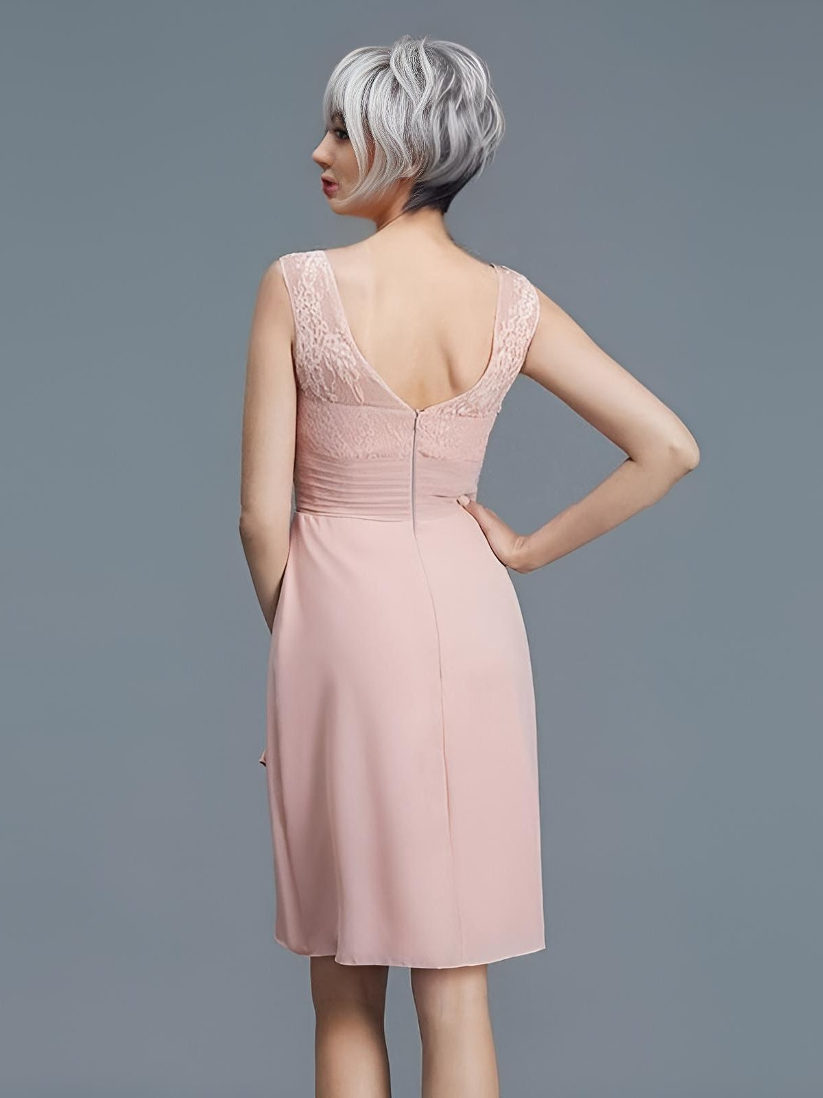 Mother of the Groom with grey hair in chiffon and lace backless sleeveless dress.