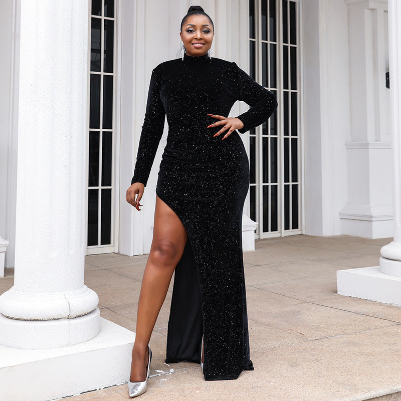 Happy woman in a black sequin dress with long sleeves