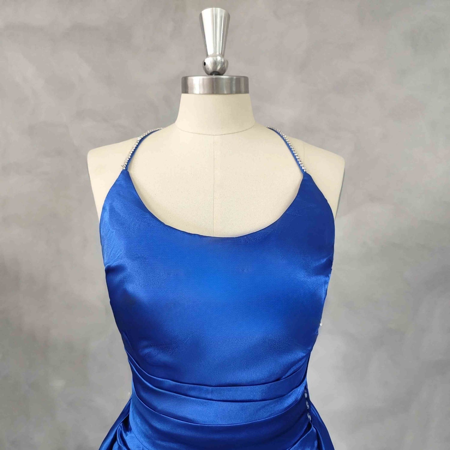 "Royal blue prom dress with pleated A-line silhouette and court train"