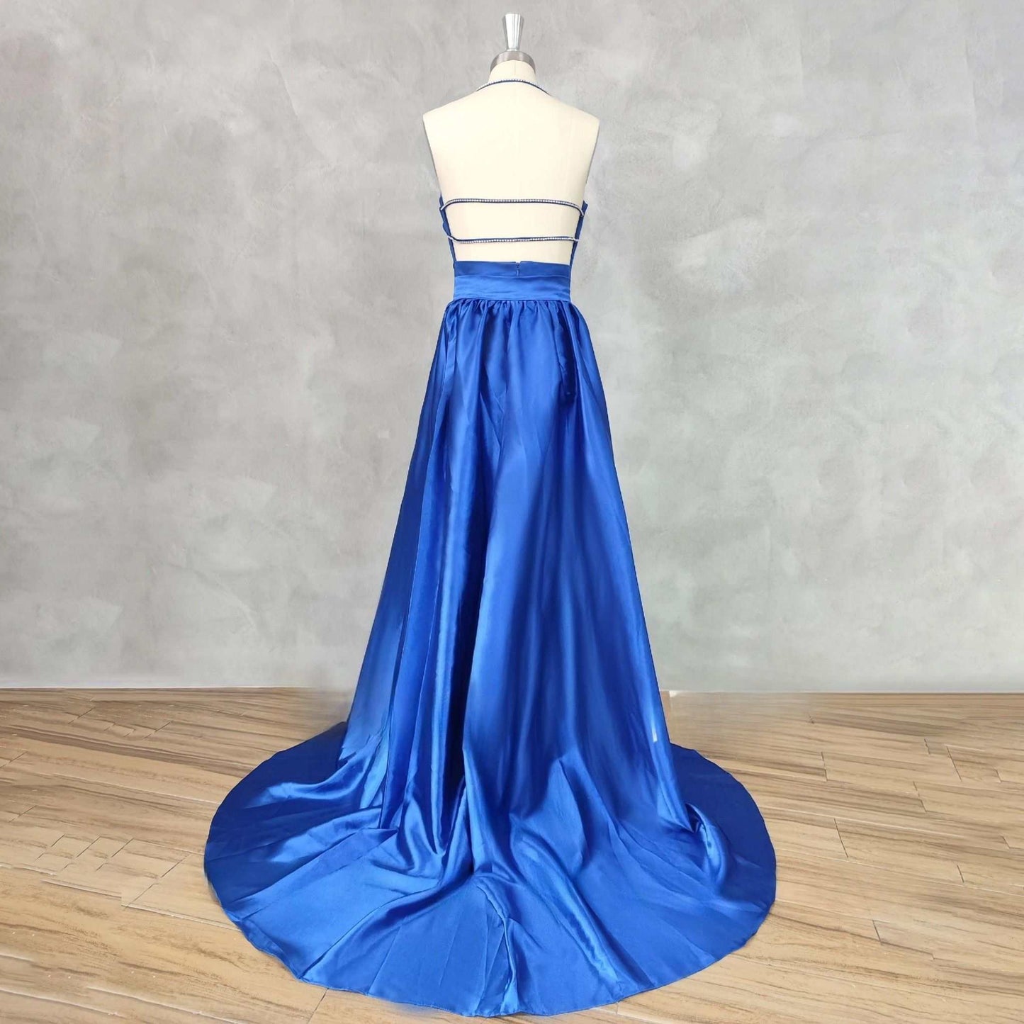 Royal blue satin evening gown with open back and court train