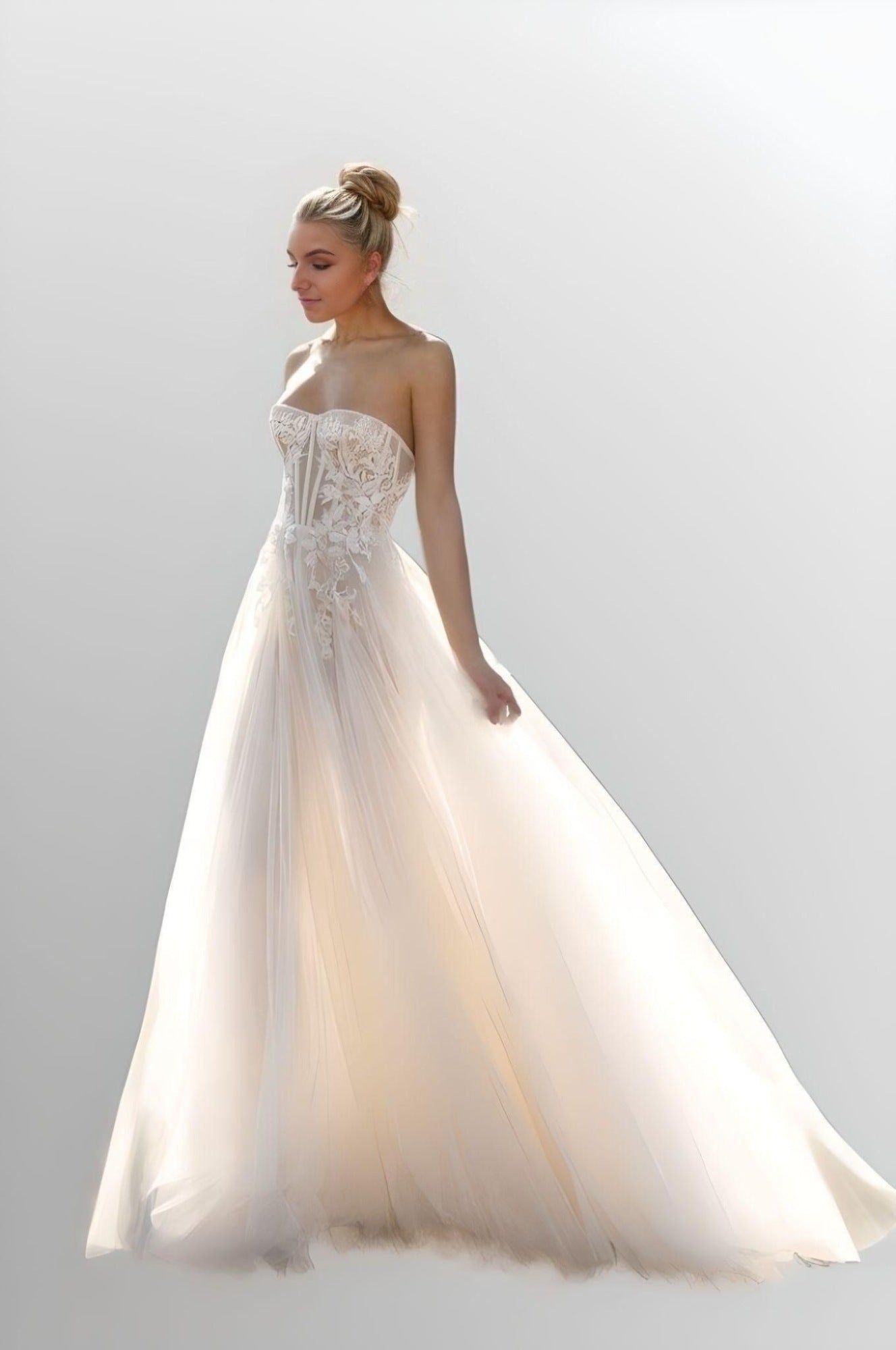 Flowing Summer Bridal Gown: A dynamic shot of the bride walking, with the tulle fabric and sweep train flowing gracefully.