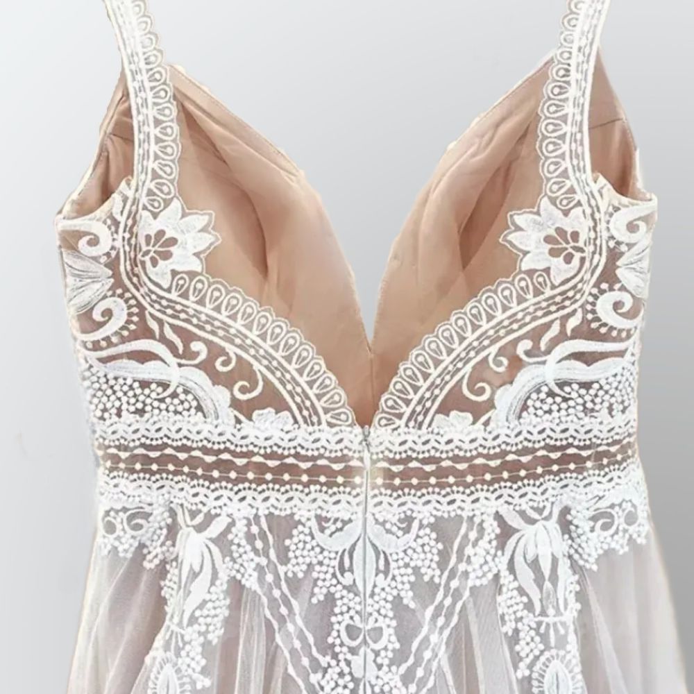 Backless Lace Bridal Gown: The Detail of behind, emphasizing the backless design and delicate spaghetti straps of the gown.