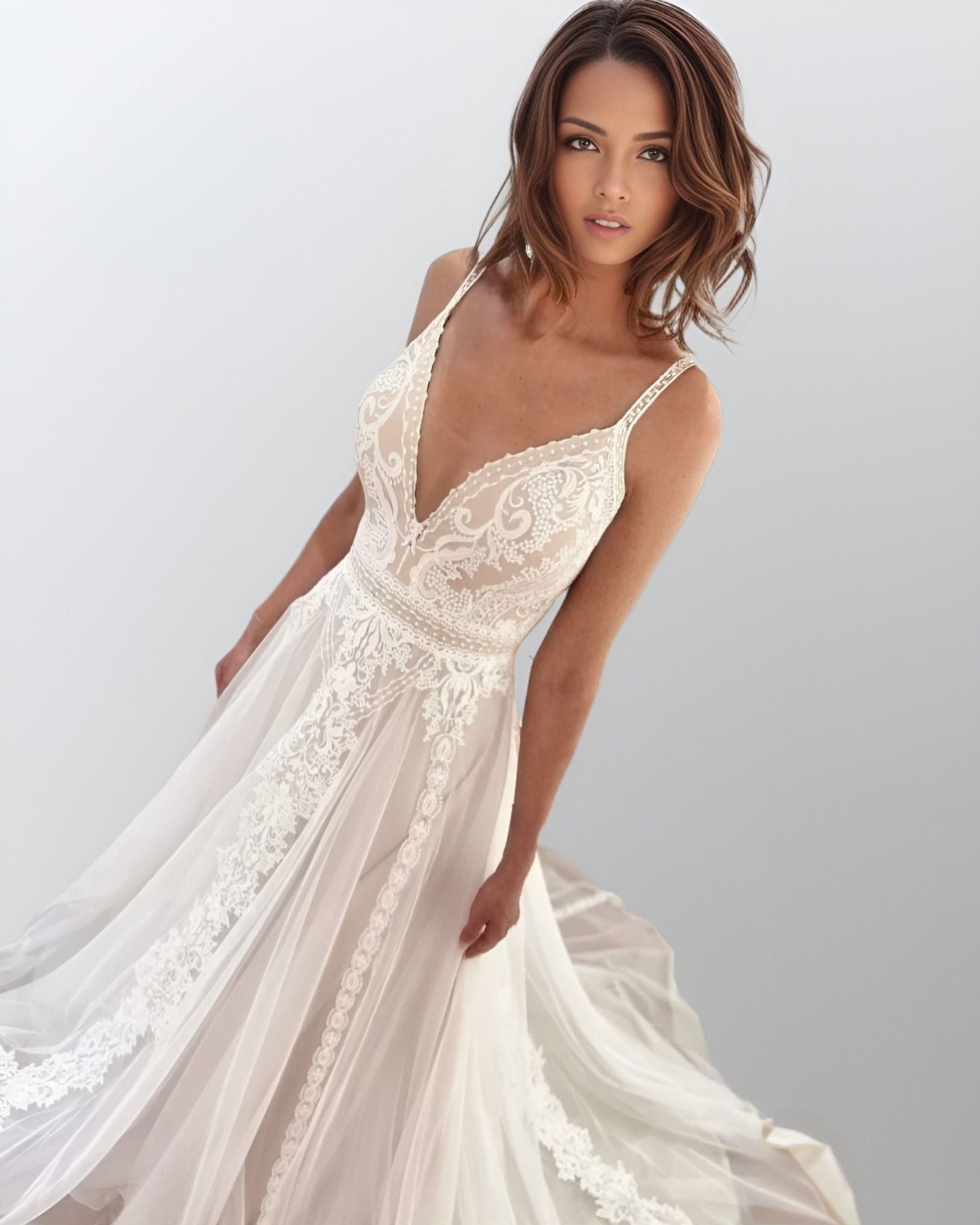 Bohemian Bride in Lace Wedding Dress: A bride showcasing the HAVEN dress, highlighting the boho style with flowing tulle and lace appliques.