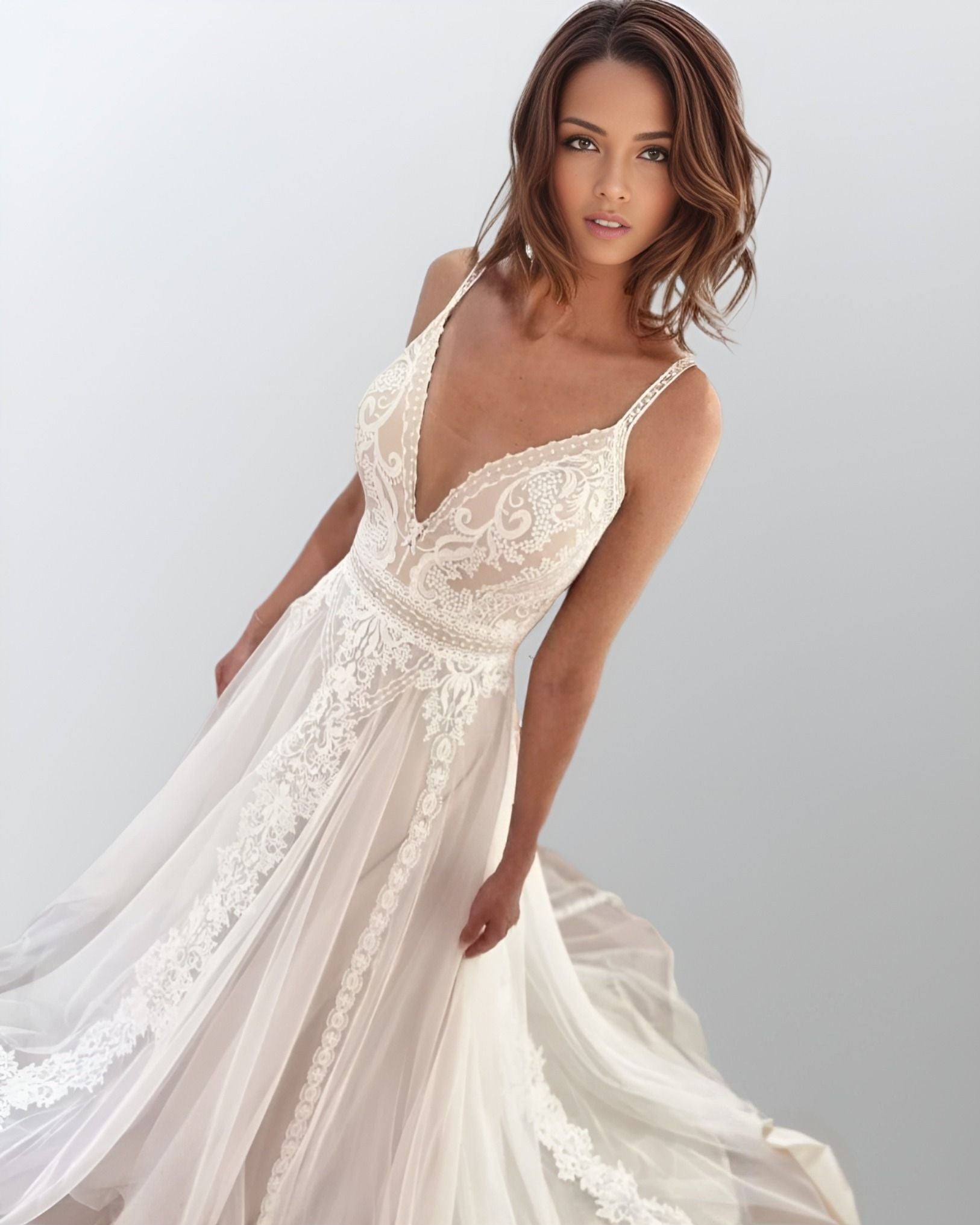 Bohemian Bride in Lace Wedding Dress: A bride showcasing the HAVEN dress, highlighting the boho style with flowing tulle and lace appliques.