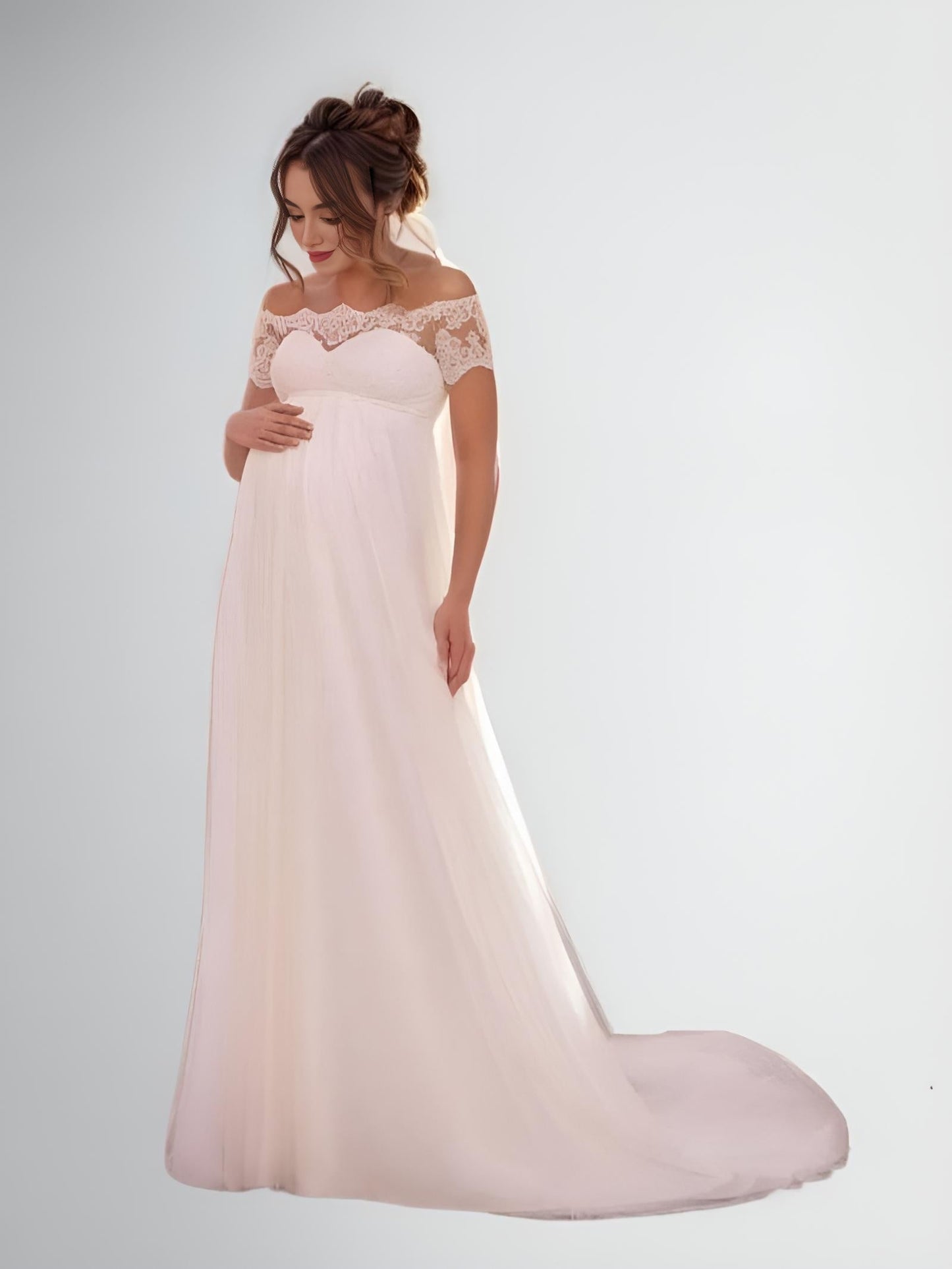 A-Line Maternity Wedding Dress in Tulle: A detailed shot of the gown's tulle fabric and empire waistline, emphasizing the dress’s soft, flowing design.