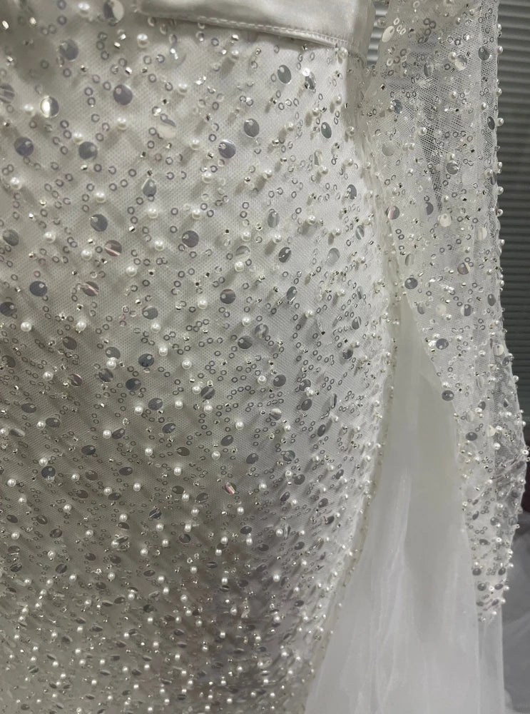 Detailed beading and sequins of mermaid wedding dress.