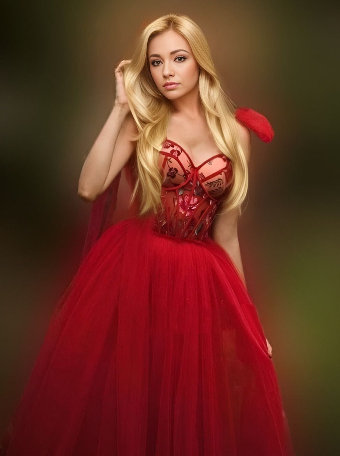 Bride or model showcasing a red A-line dress with floral fabric on the bust, perfect for formal events.