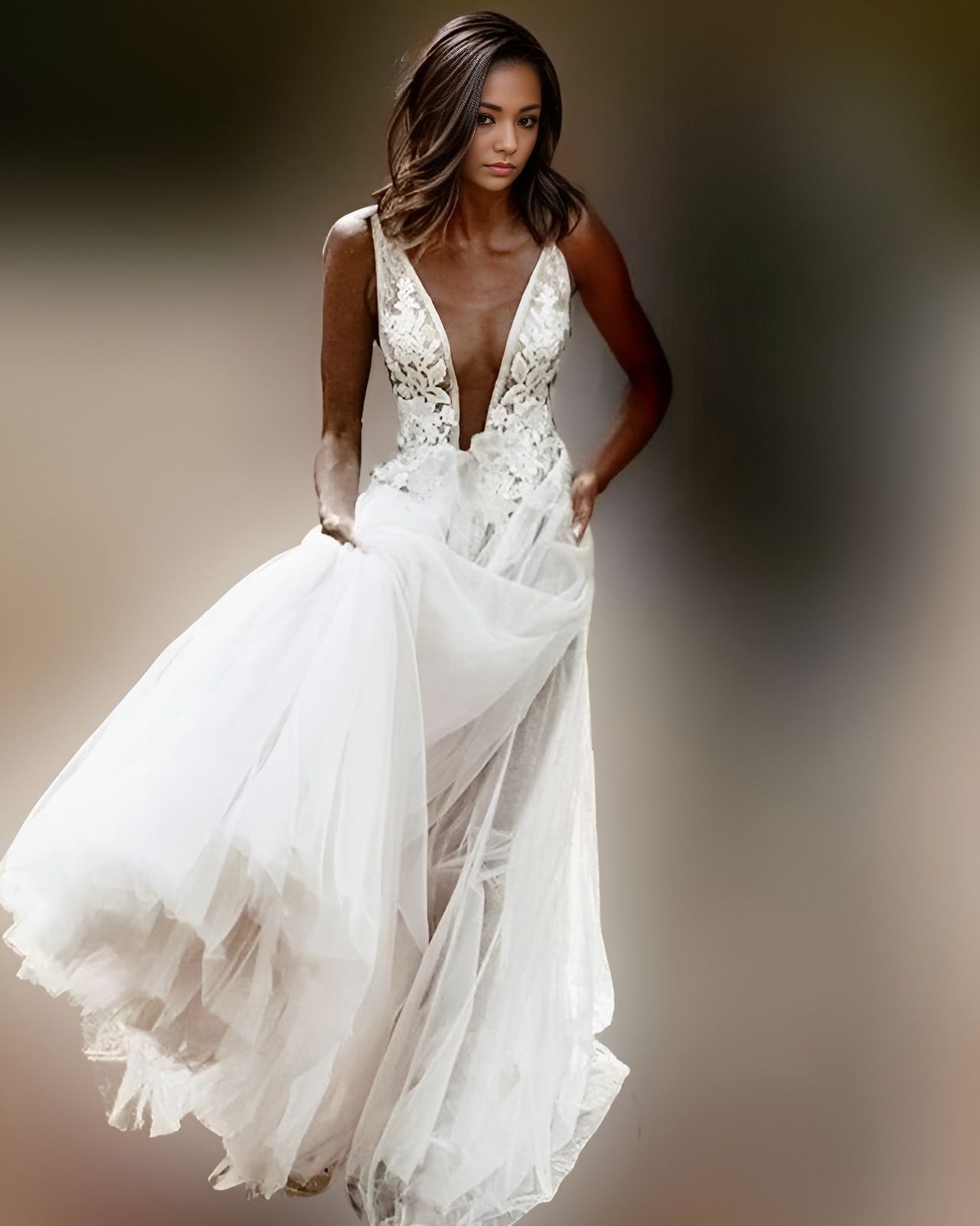 Elegant boho wedding dress featuring a see-through tulle skirt with lace appliques, all in A-line silhouette.