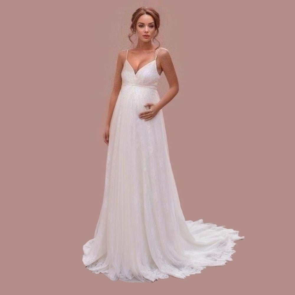 Pregant bride in a full lace maternity wedding dress with spaghetti straps, perfect for an elegant bridal look.