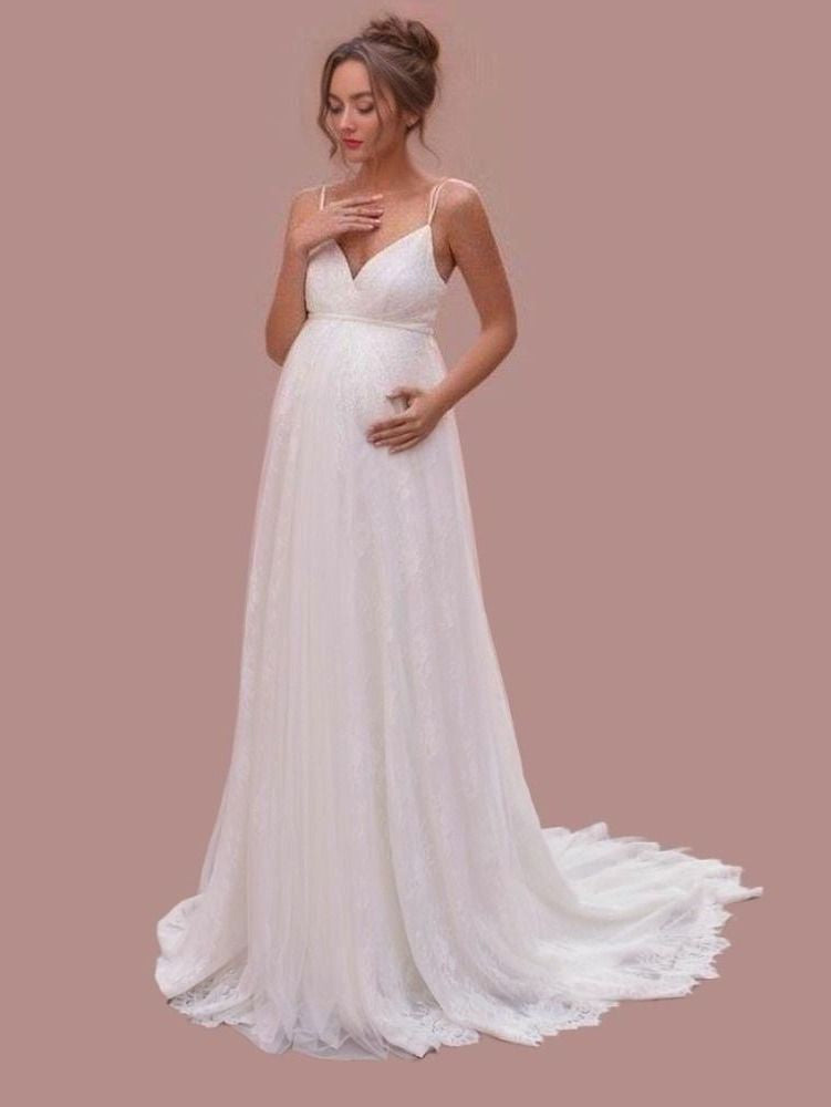 Maternity bride wearing a V-neck wedding dress with spaghetti straps and a lace A-line empire silhouette, designed for a romantic wedding.