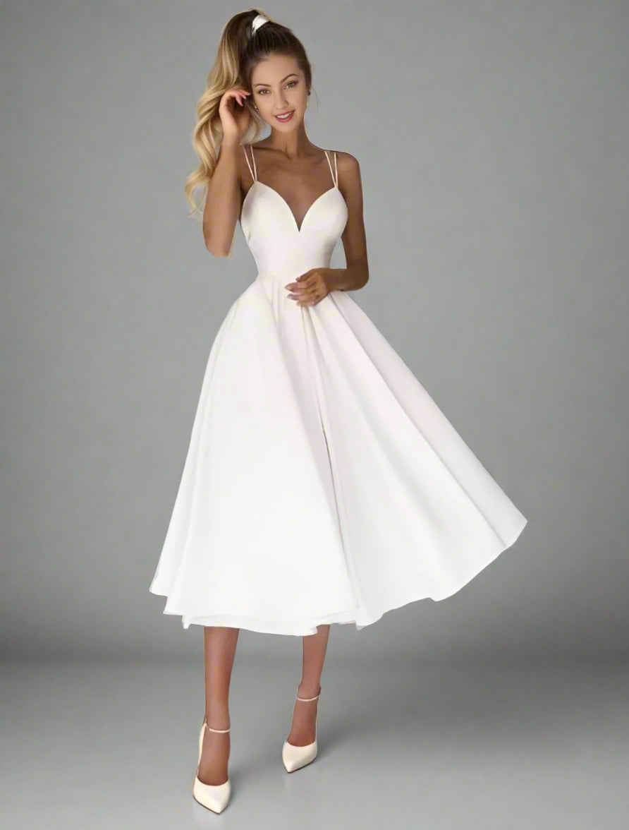 Happy woman in Elegant tea-length wedding dress featuring a pleated skirt and V-neckline, ideal for special occasions.