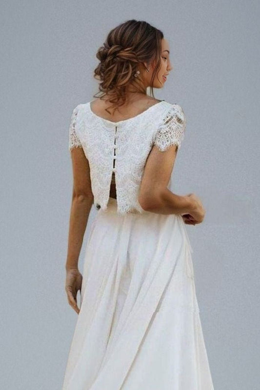 Back detail of chic bridal gown featuring a laced top with cap sleeves and a button-back design, perfect for a sophisticated boho wedding.