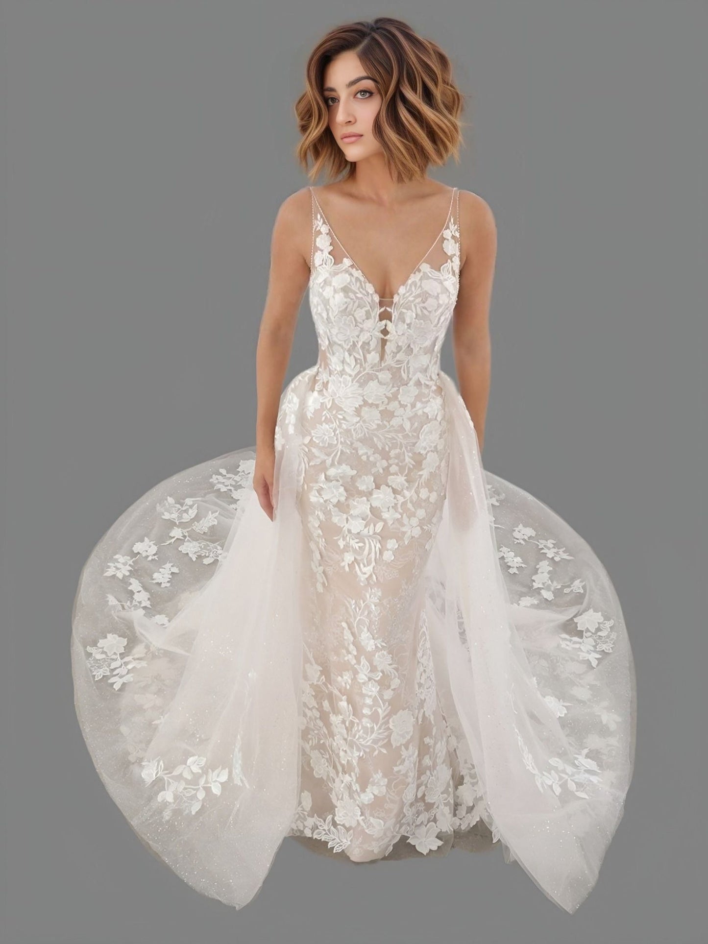 Woman in elegant floral lace wedding dress with a deep V-neckline, spaghetti straps, and floral lace appliques with a detachable A-line overskirt