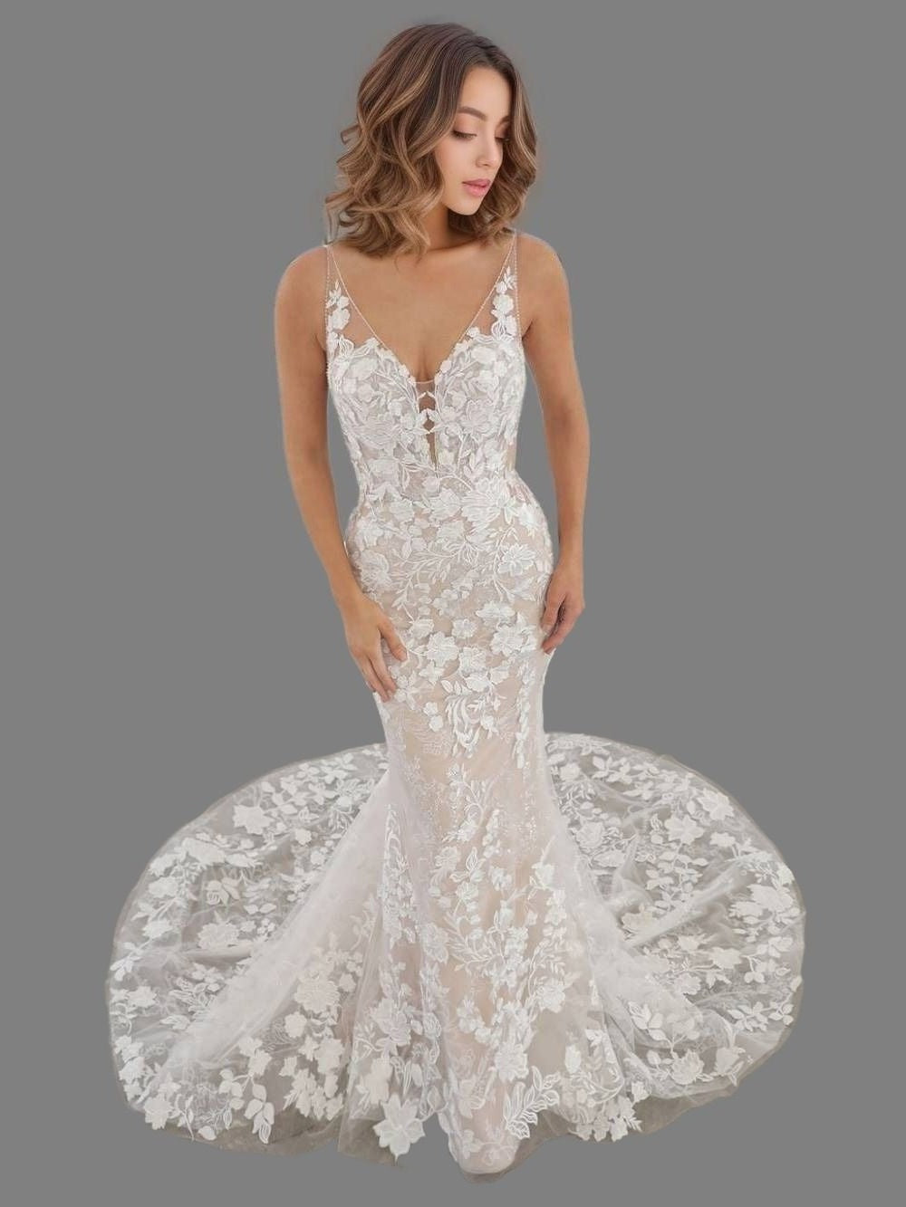 Woman in romantic lace wedding dress in trumpet silhouette with a sweep train, designed for a timeless and ethereal bridal look.