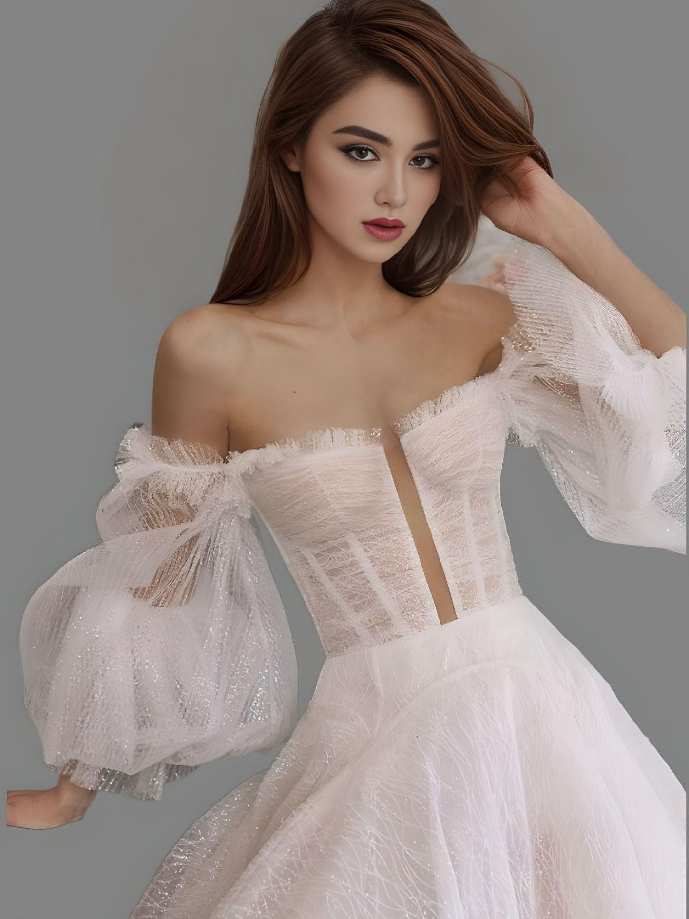 Bride showcasing a sparkling glittered tulle wedding gown with a sweetheart neckline and deep cutout illusion, ideal for a princess-inspired bridal look.