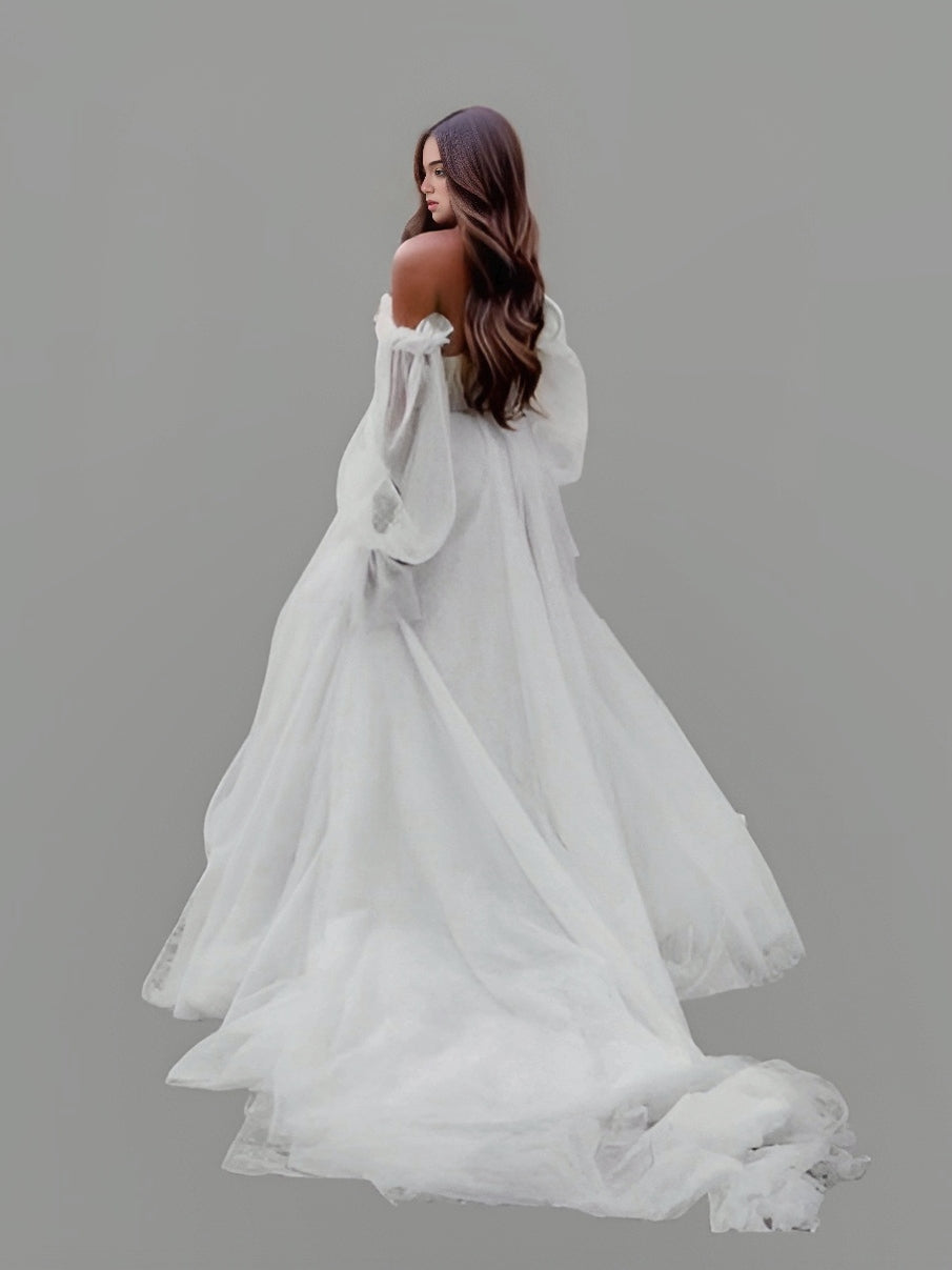 Model from back wearing an off-shoulder wedding dress with puff sleeves, pleated bodice, and chapel train, perfect for a romantic and elegant wedding.