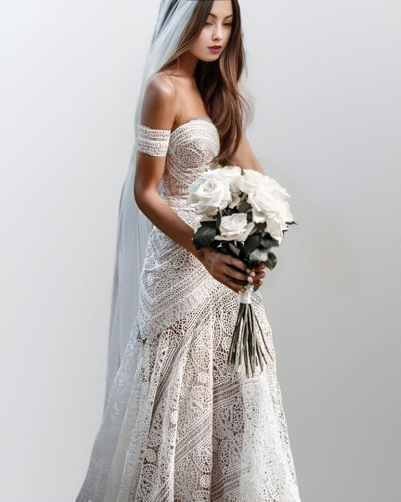 Bride holding bouquet, displaying a full lace wedding dress with a sweetheart neckline and off-shoulder lace straps, perfect for a dreamy, ethereal look.
