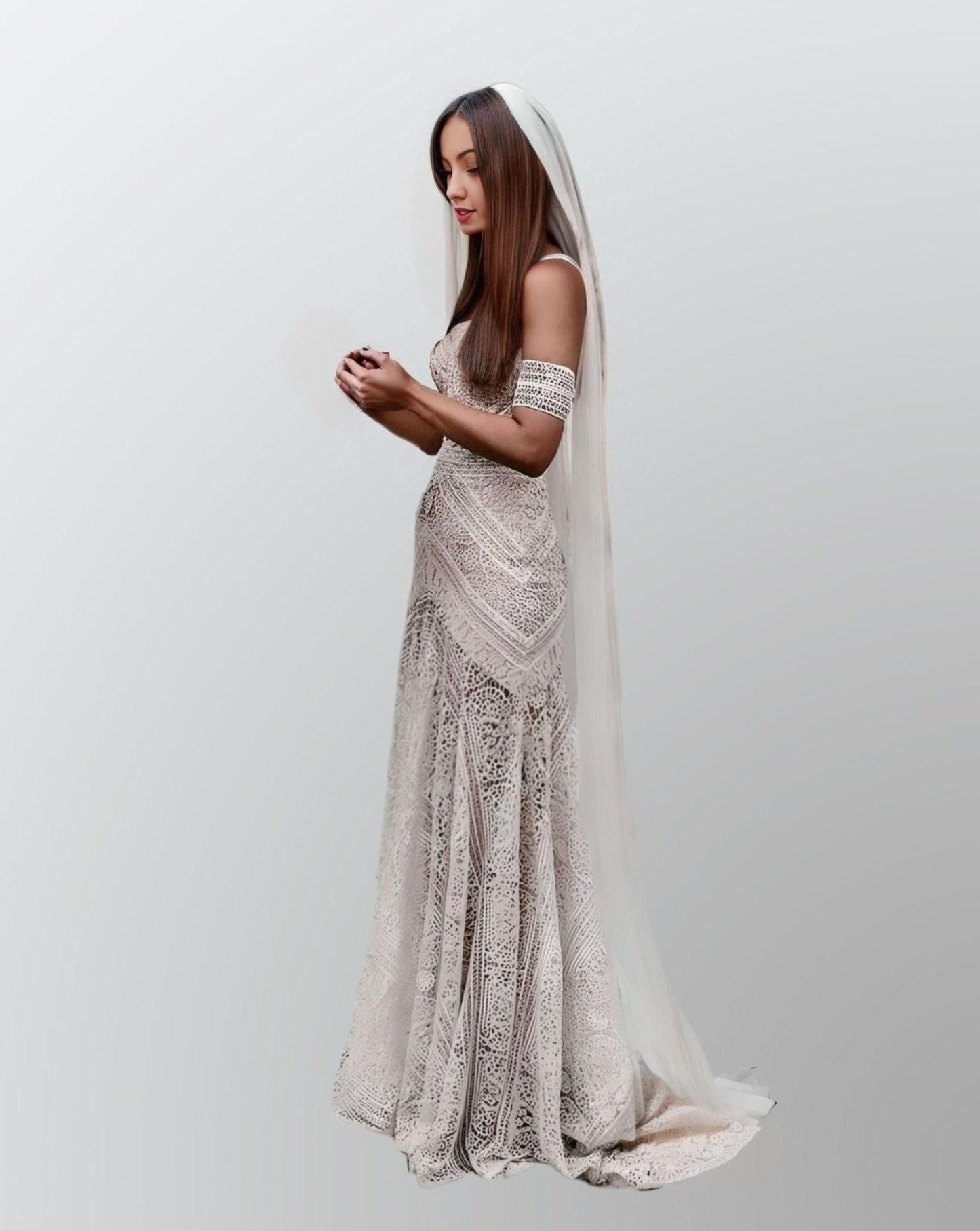 Woman in a fitted, full lace wedding dress with a romantic sweetheart neckline and off-shoulder lace arm straps, ideal for a beach or garden setting.