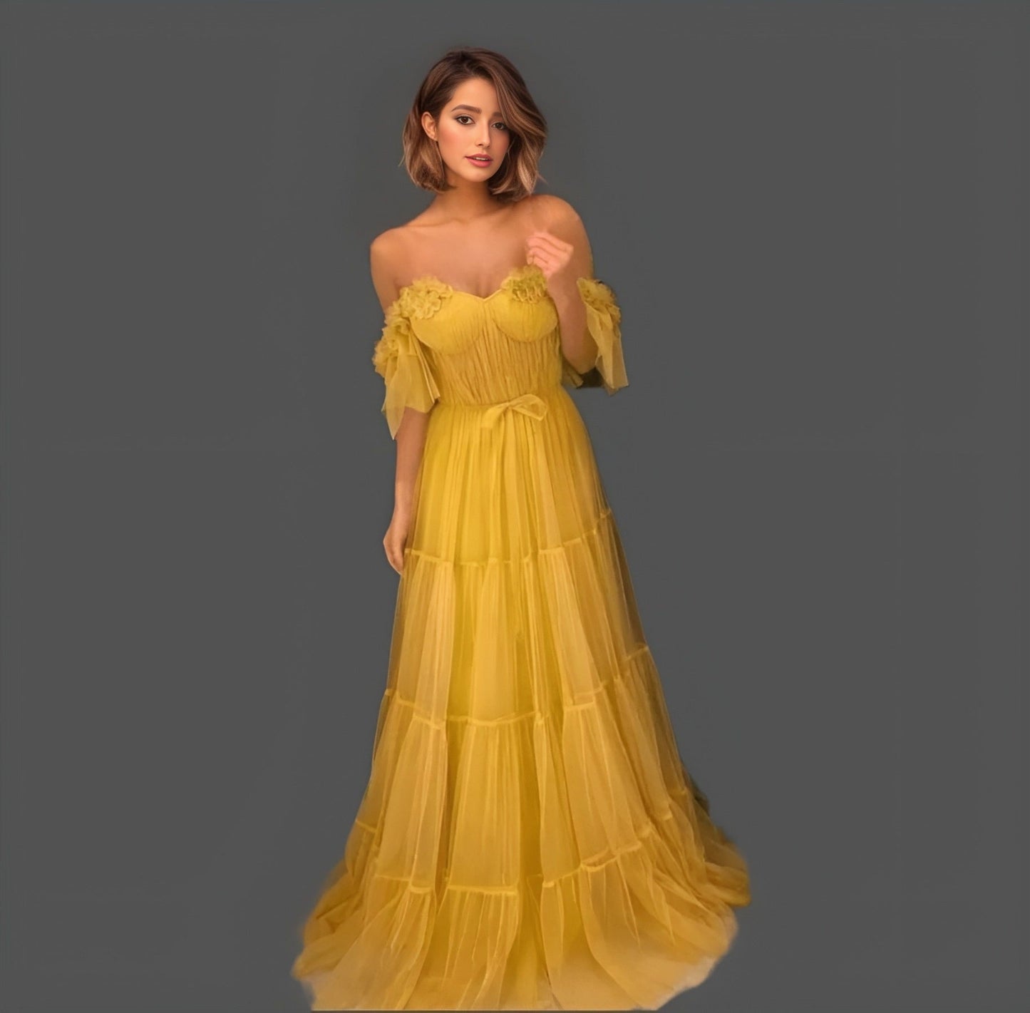 Model showcasing a yellow A-line gown with a sweetheart neckline, off-the-shoulder design, and 3D flower appliques, perfect for prom or evening events.