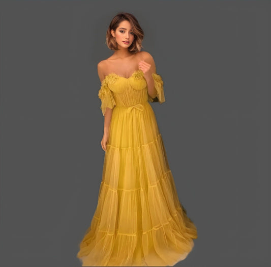 Model showcasing a yellow A-line gown with a sweetheart neckline, off-the-shoulder design, and 3D flower appliques, perfect for prom or evening events.