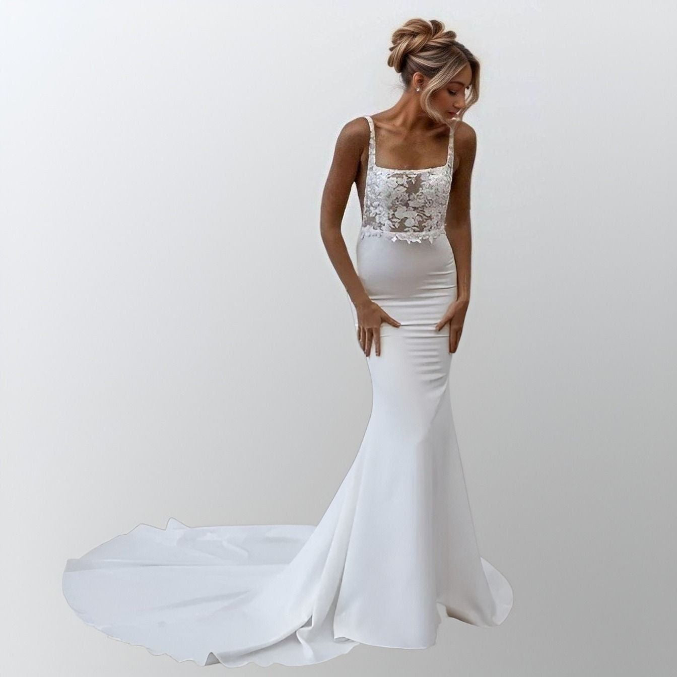 Model showcasing a mermaid silhouette bridal gown with lace appliques, a square collar, and side cutouts, perfect for a boho-chic wedding.