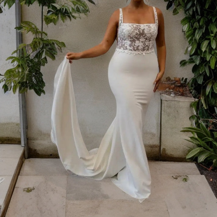 Plus size woman in a wedding dress featuring a square collar and a sweep train, designed for a sensual and sophisticated wedding style.