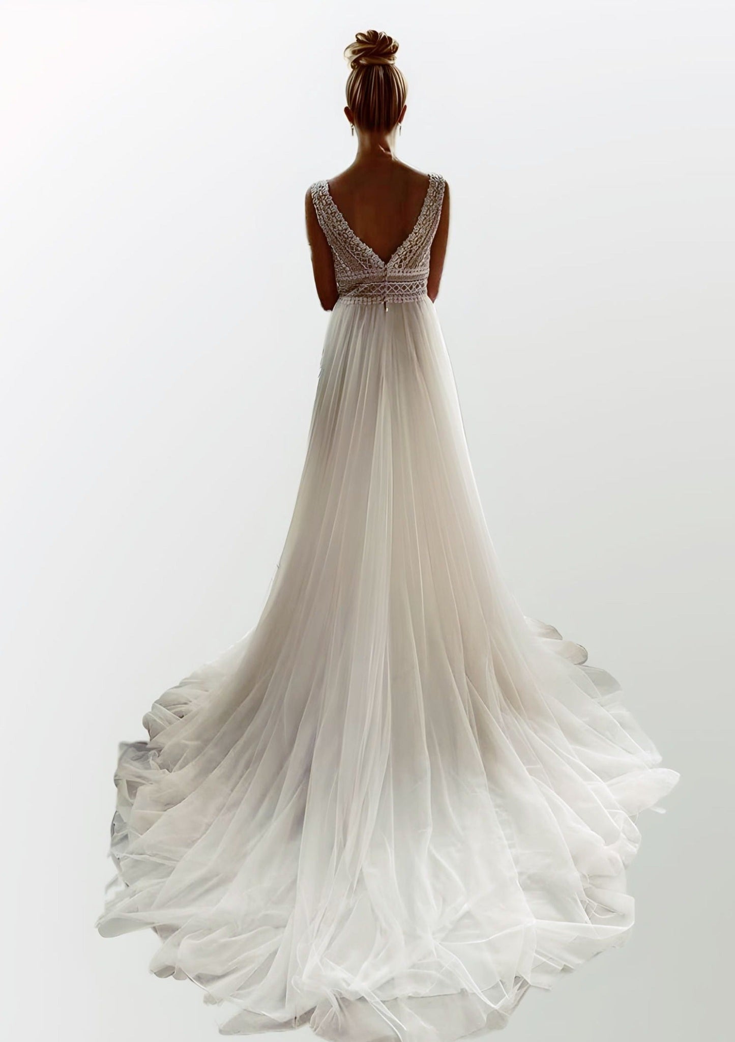 Elegant A-line bridal gown featuring a straight lace top, V back and tulle skirt with a sweep train, ideal for a boho-inspired wedding.