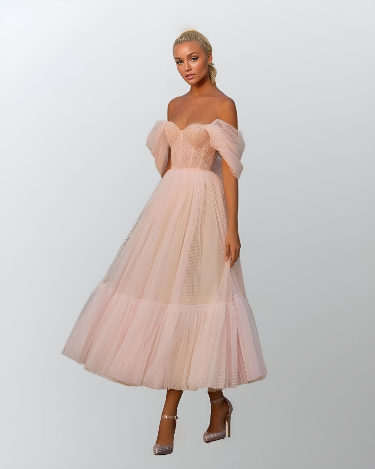 Model showcasing a blush pink gown with a pleated bodice, off-shoulder layered puff sleeves, and a tea-length tiered skirt, perfect for prom or formal events.
