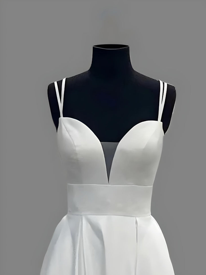 Neckline close up of a simple A-line wedding dress with a sweetheart neckline and a defined waist.