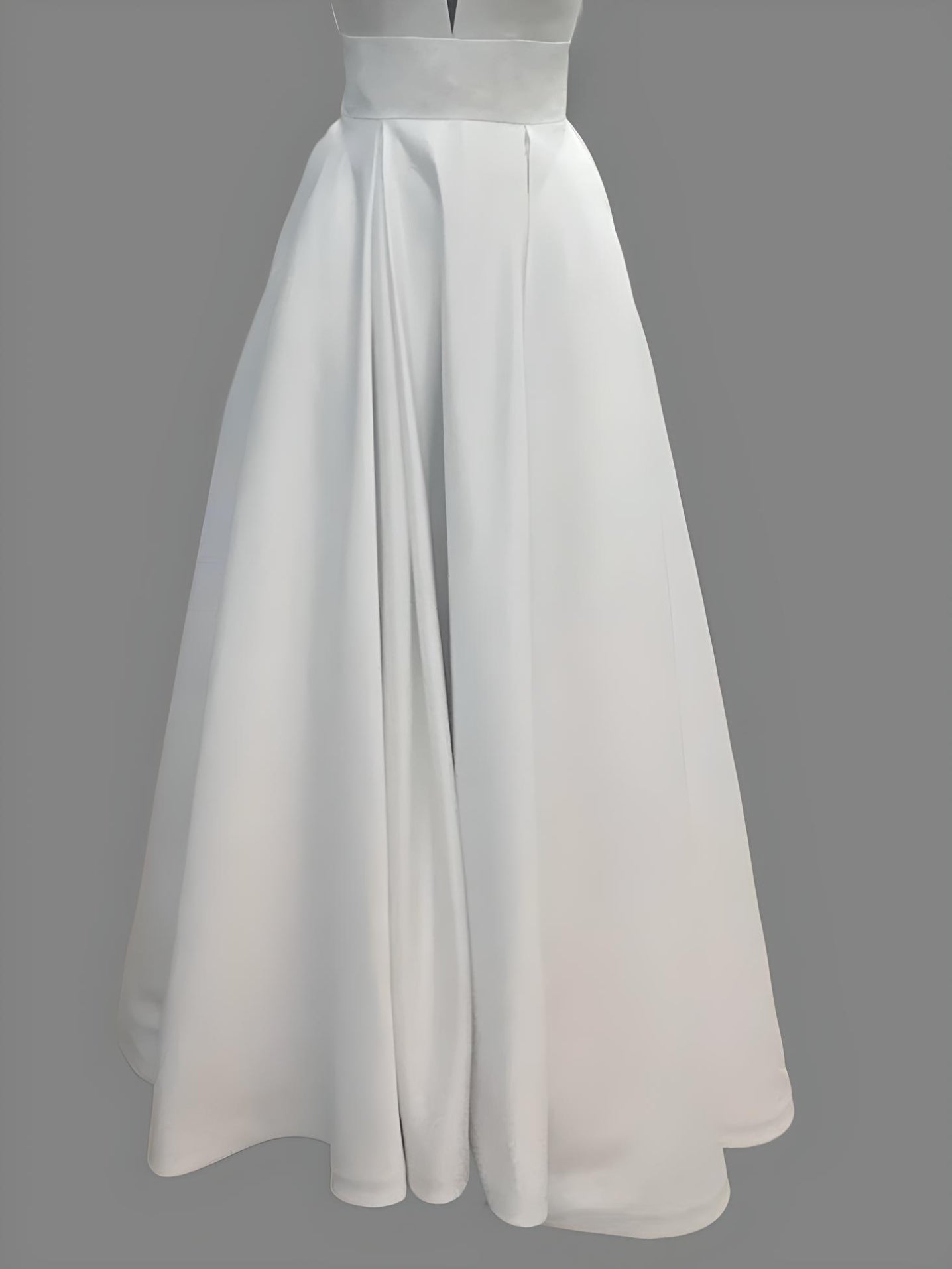 Detail of bottom part kelsie wedding dress with a flowing skirt, perfect for elegant weddings.