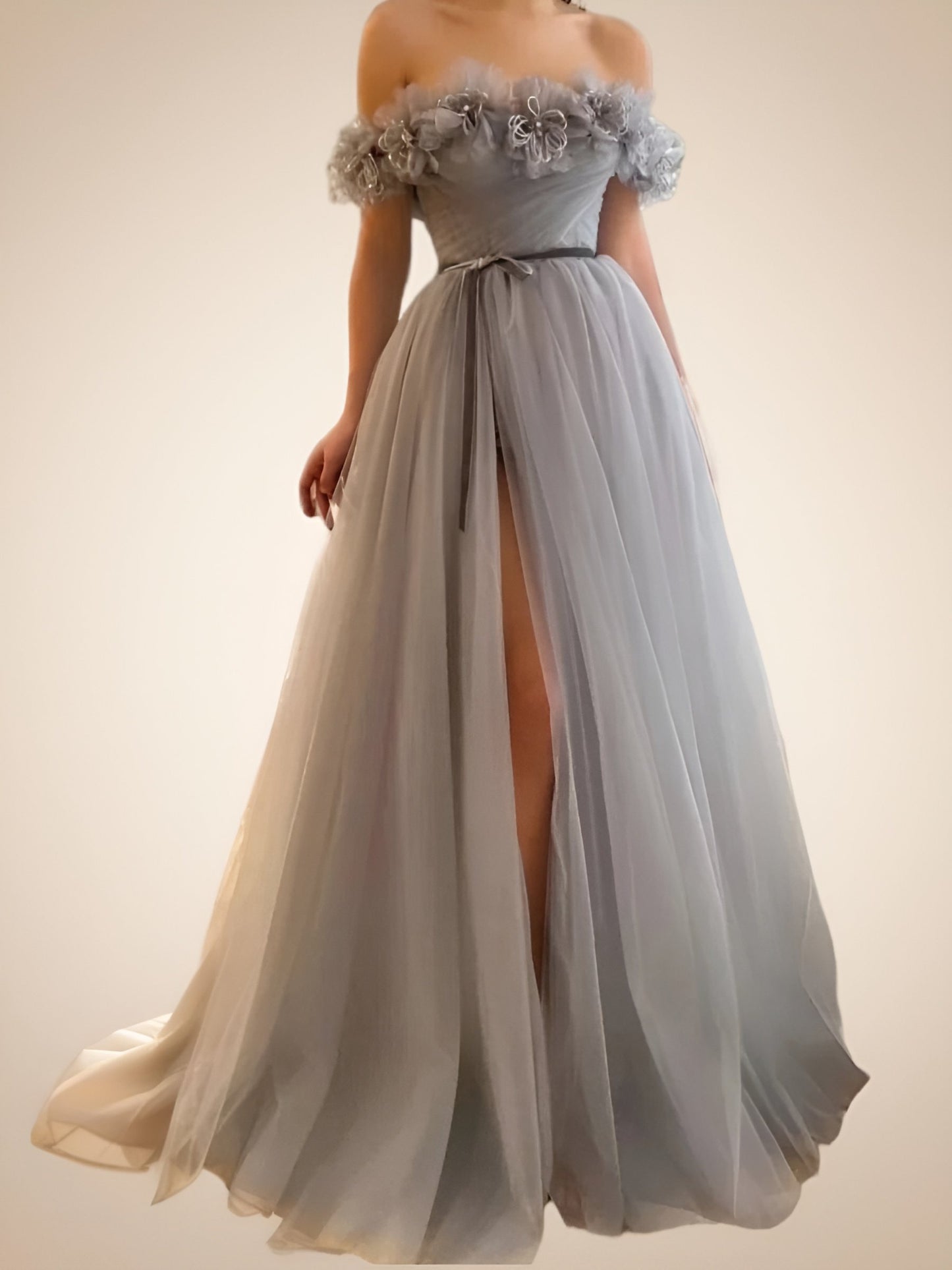 Model in the LARA dress, highlighting the A-line silhouette and high split