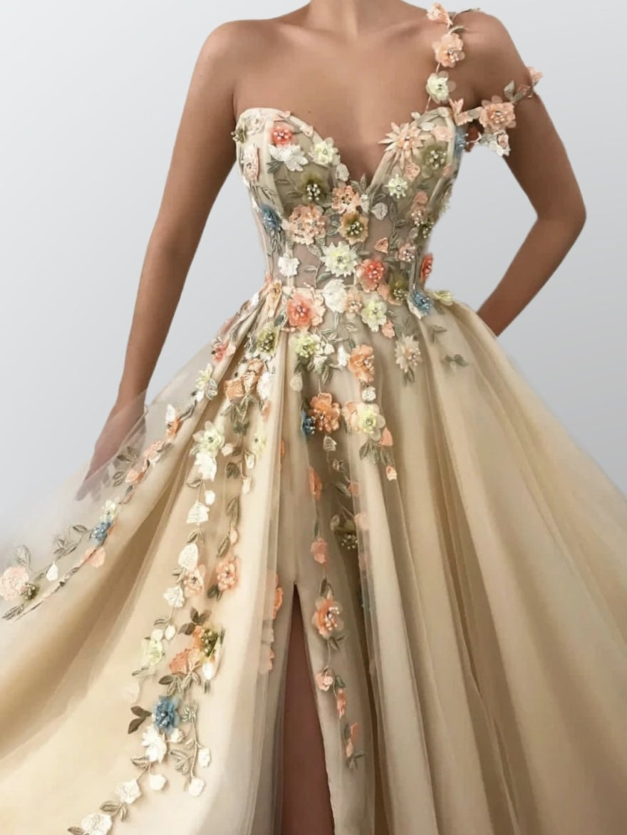 Model wearing LIBBY dress, highlighting flowing tulle skirt and high slit.