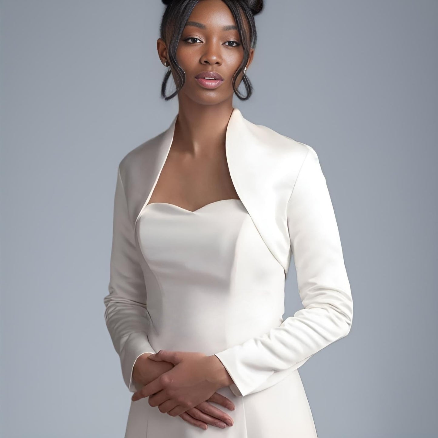 Model wearing Long Sleeve Satin Wedding Jacket with elegant high collar over bridal gown.
