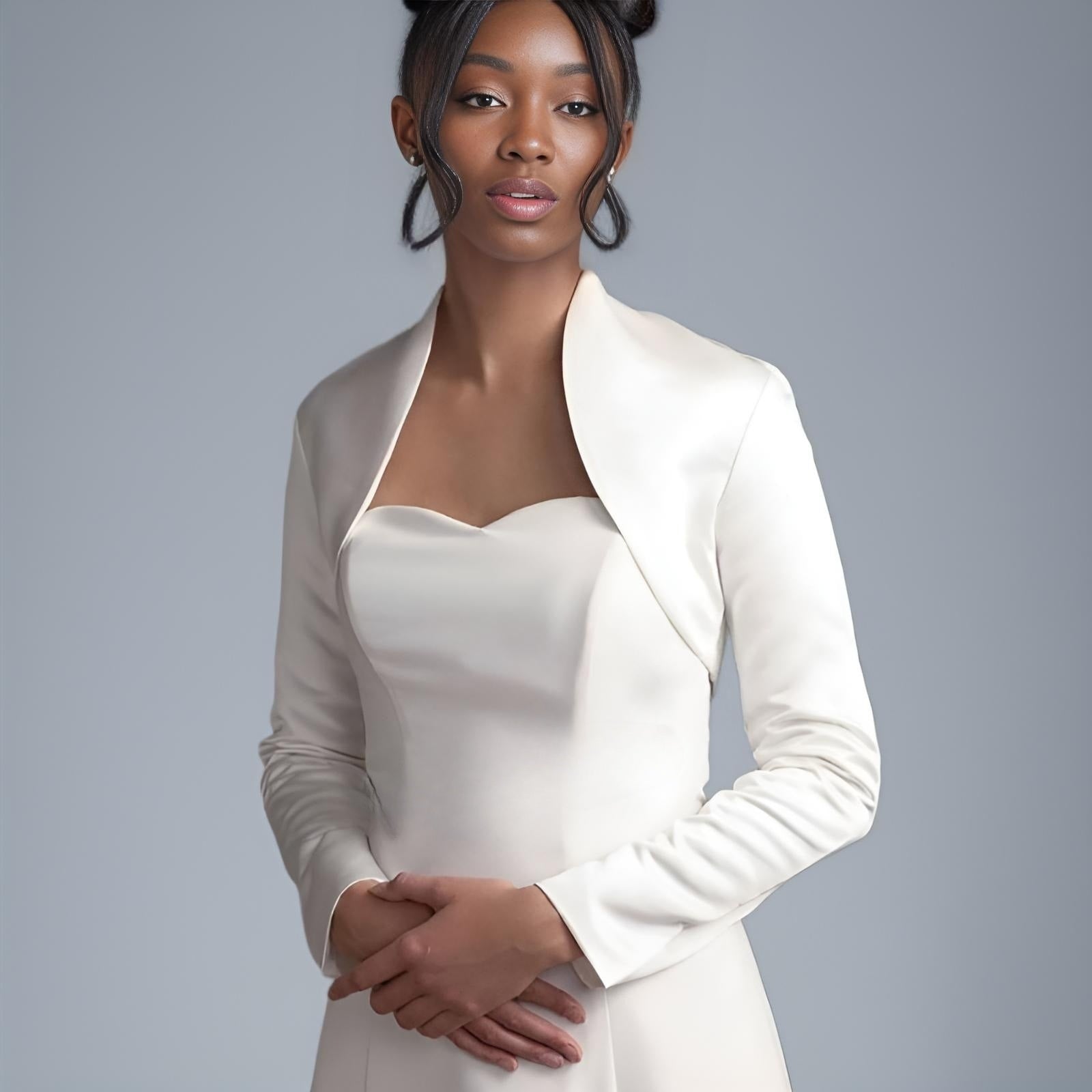 Model wearing Long Sleeve Satin Wedding Jacket with elegant high collar over bridal gown.