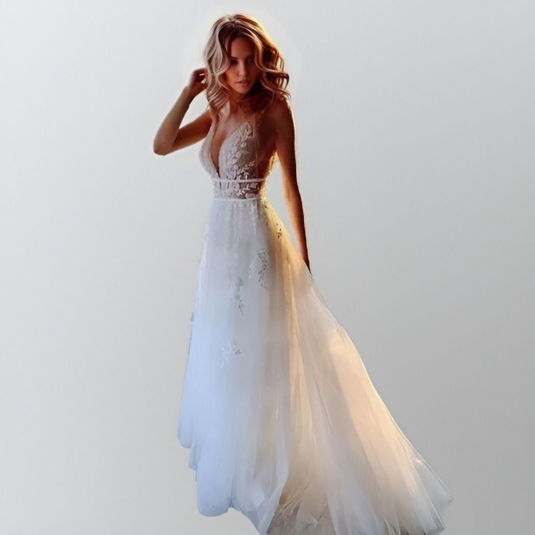 Front view of Lucy Wedding Dress with bohemian lace and deep V-neck