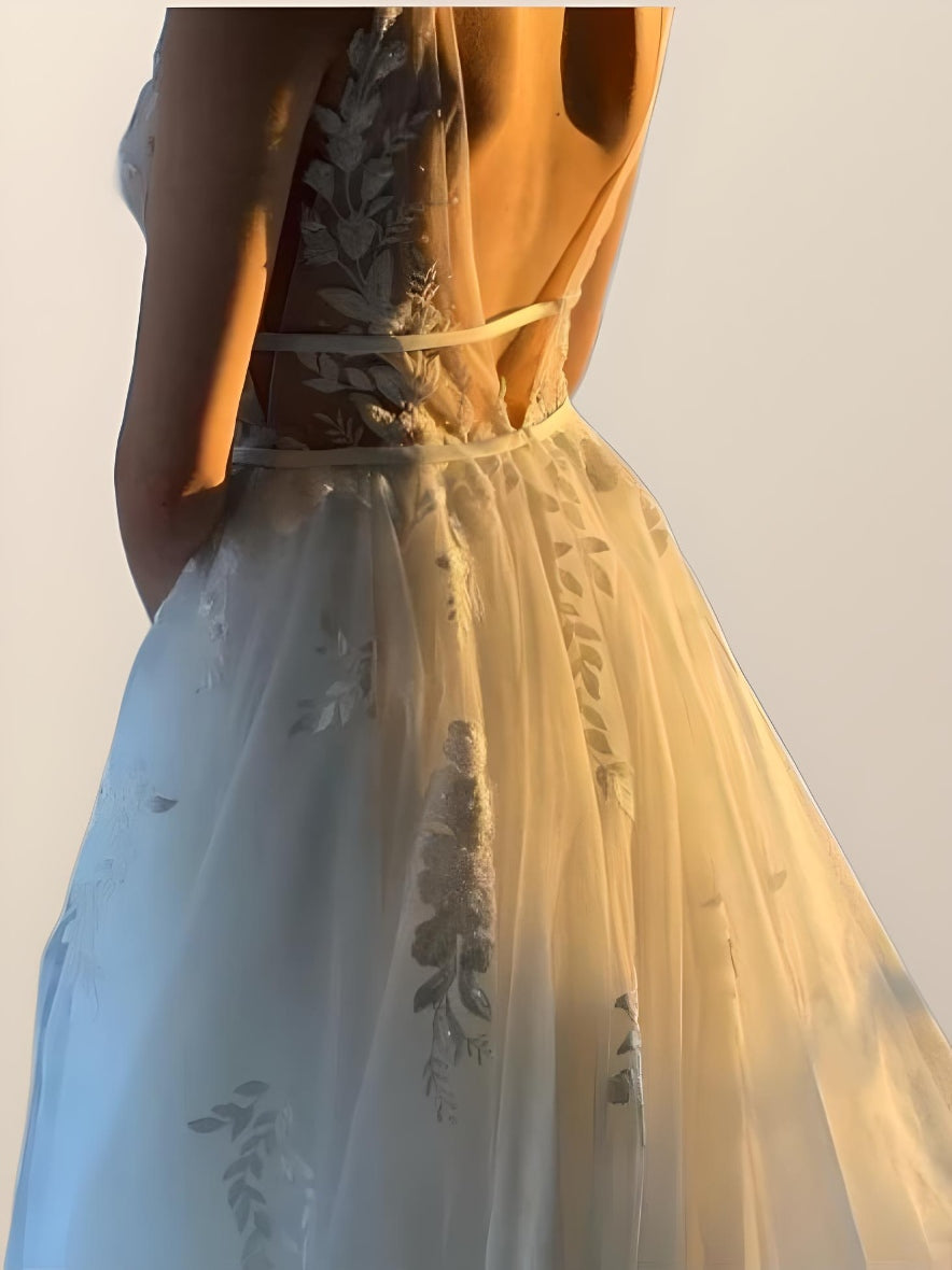 Backless design of boho-inspired Lucy Wedding Dress with sweeping train