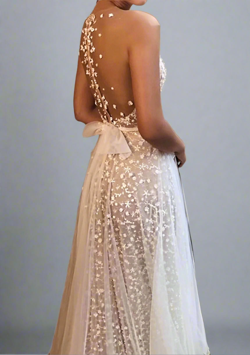 Close-up of delicate floral appliqués on LULA Bridal CLAIRE wedding gown.