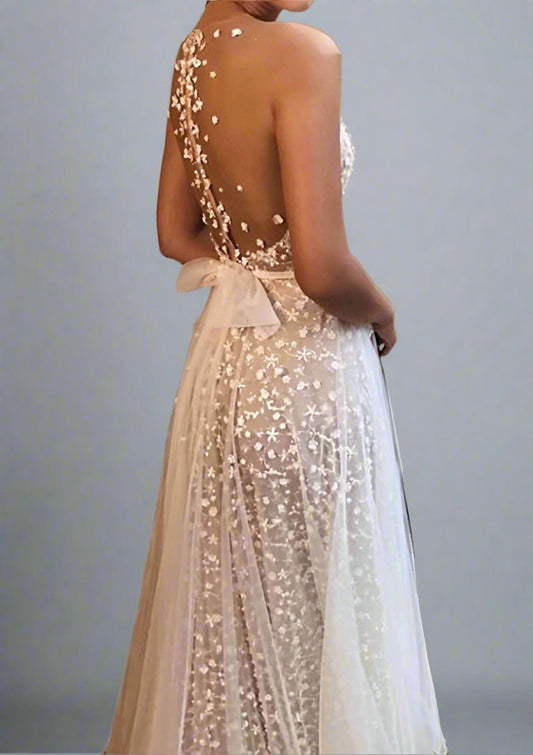 Close-up of delicate floral appliqués on LULA Bridal CLAIRE wedding gown.