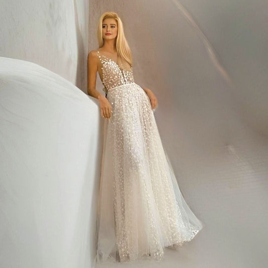 Bride wearing LULA Bridal CLAIRE A-line tulle wedding dress with floral bodice.