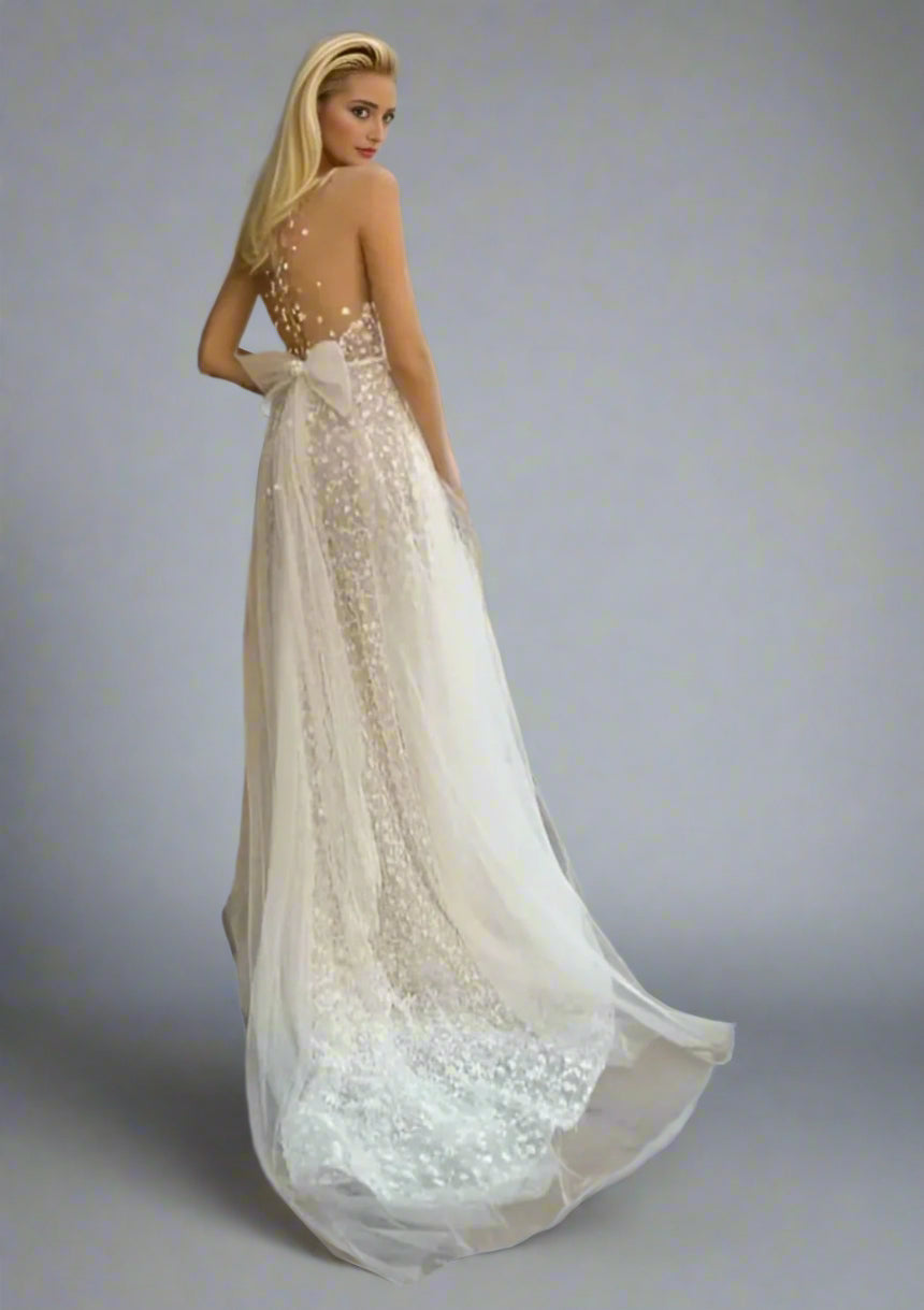 Bride showing sweep train of LULA Bridal CLAIRE wedding dress with tulle skirt