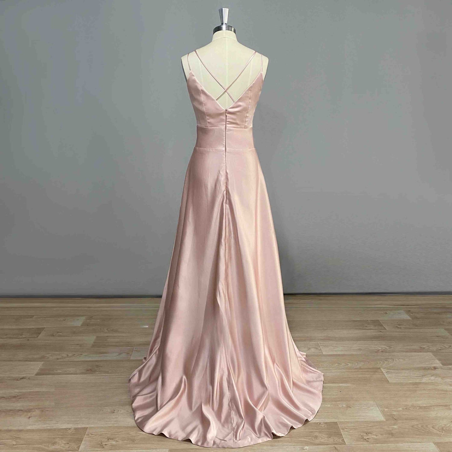 Back view of COSIMA Formal Dress on a figurine, highlighting criss-cross strap design