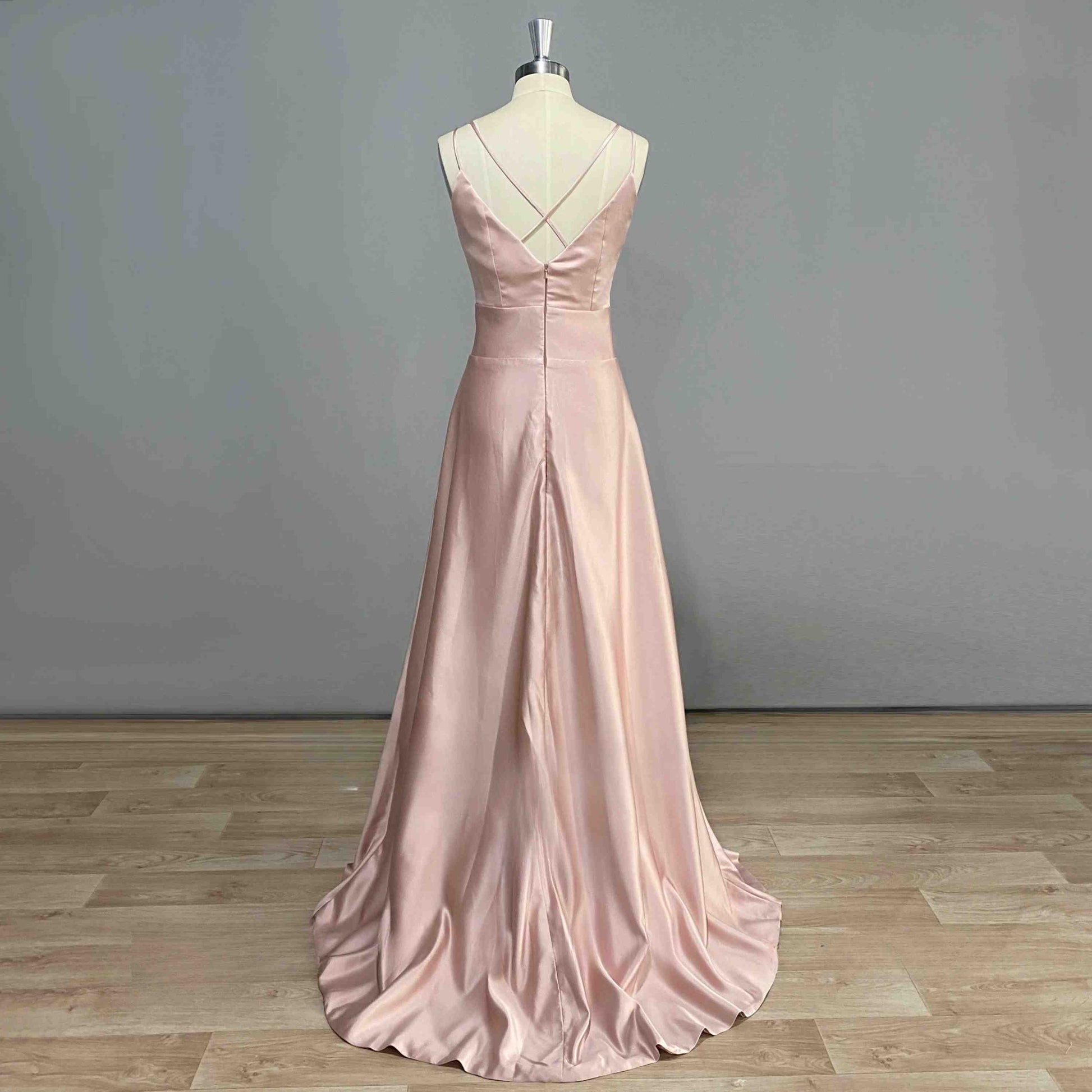 Back view of COSIMA Formal Dress on a figurine, highlighting criss-cross strap design