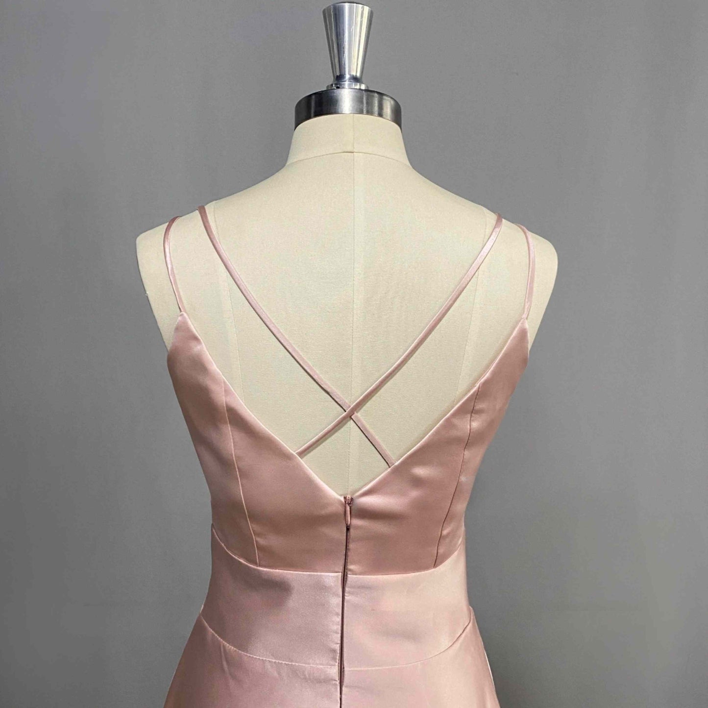 Close-up of criss-cross open back design on pink Formal Dress