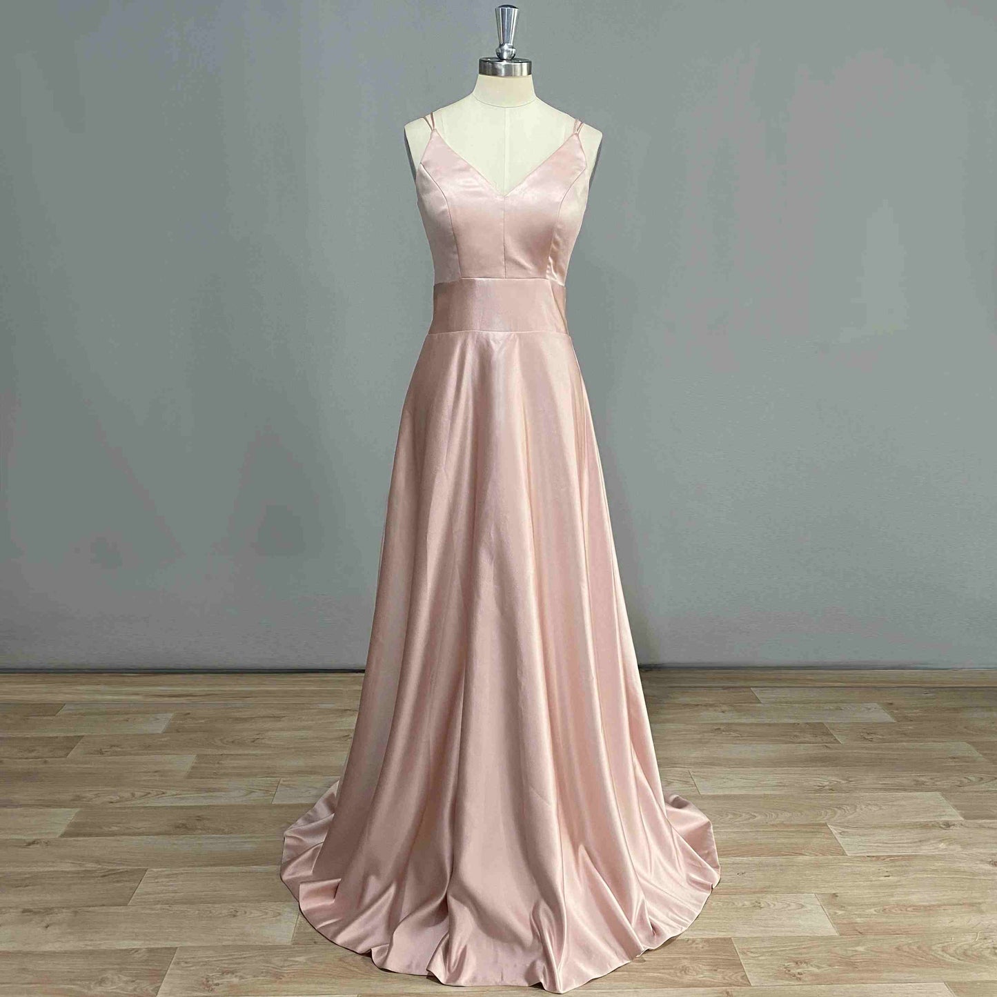 Front view of COSIMA Formal Dress on a figurine, showcasing V-neckline and A-line silhouette