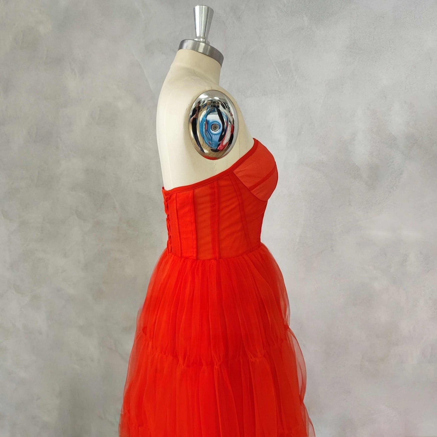 Side view of scarlet red Formal Dress with A-line silhouette