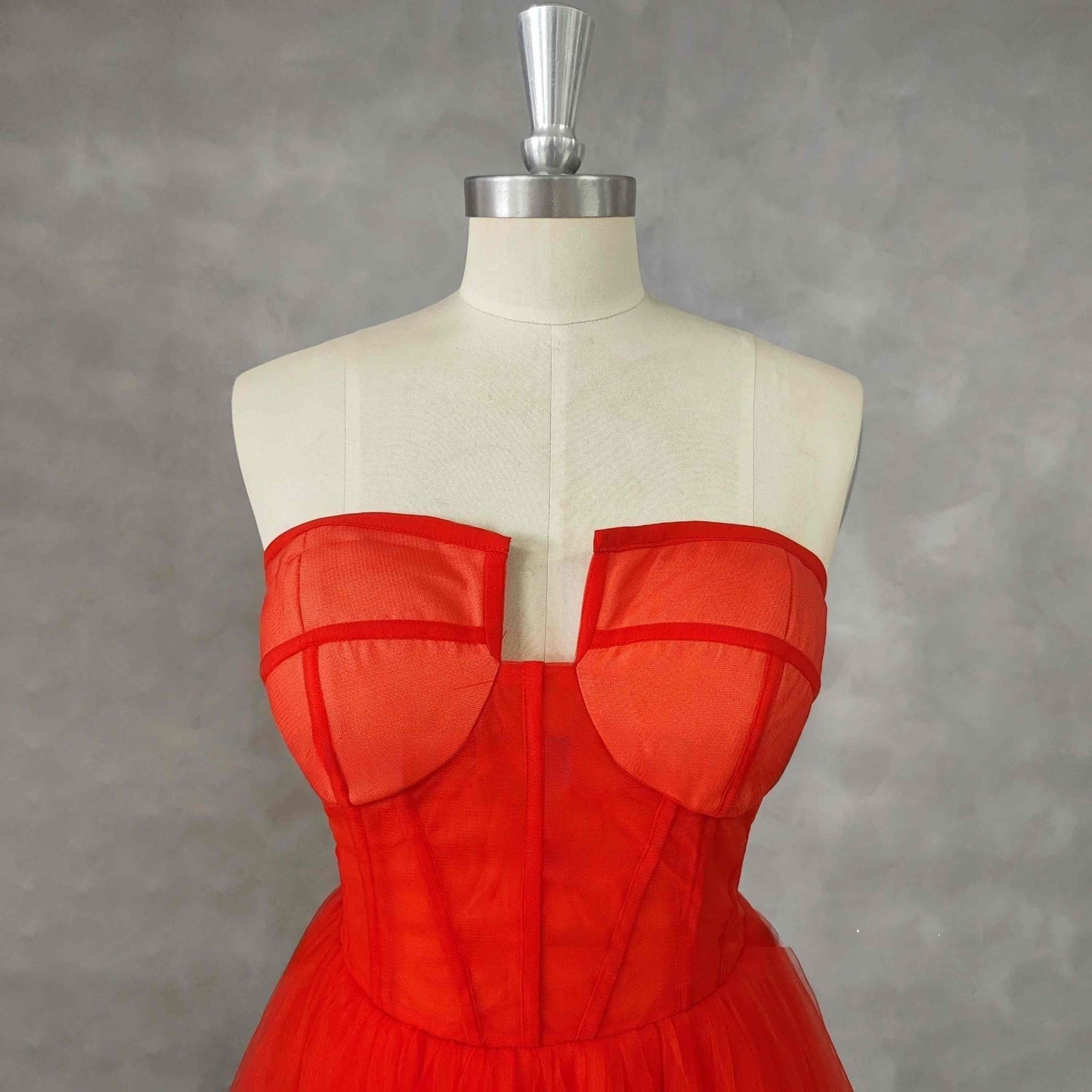 Close-up of tulle fabric on strapless Red Formal Dress bodice