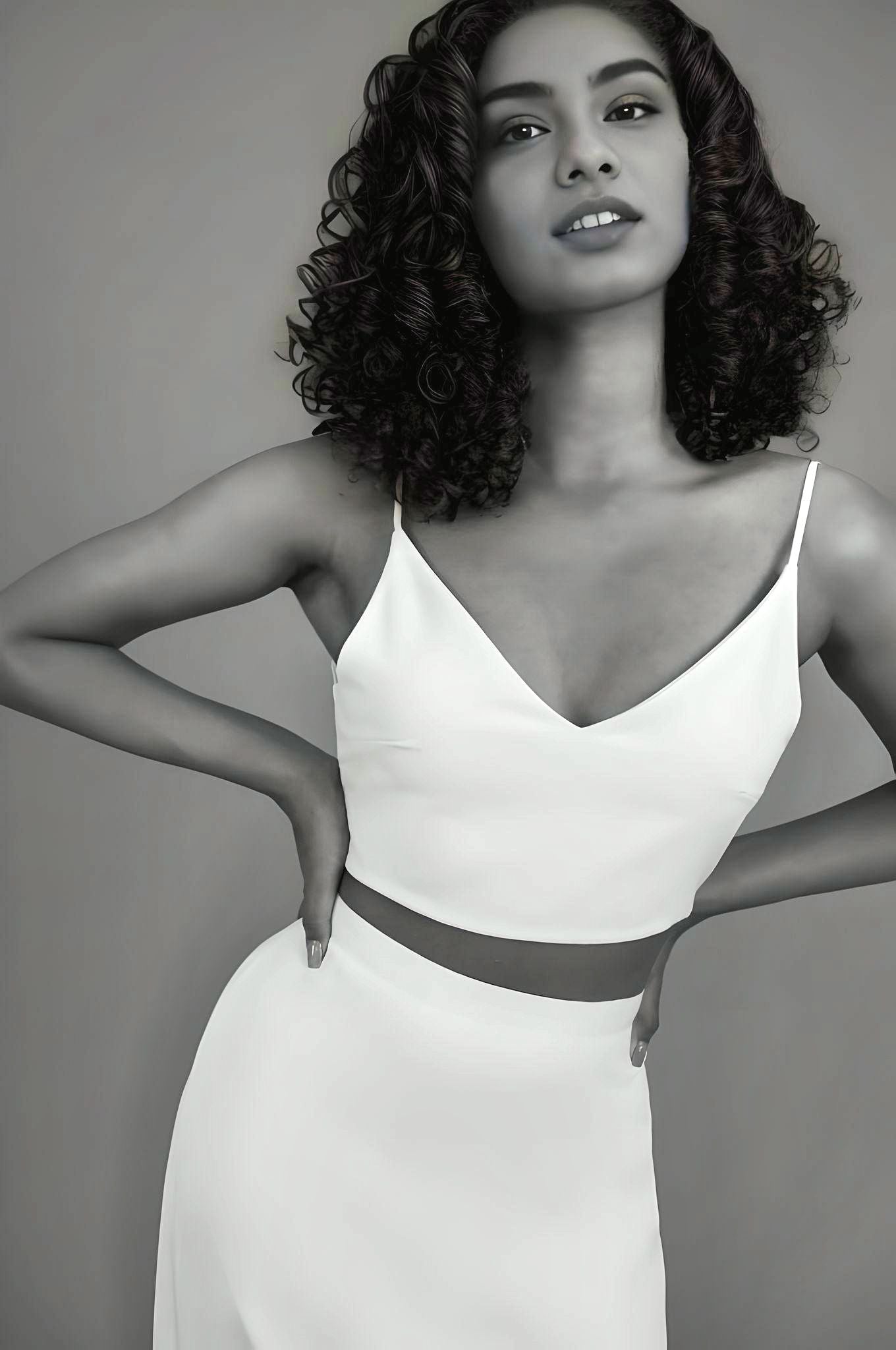 Close-up of top part of two-piece bridal gown with a V-neck and spaghetti straps, creating a simple yet stunning bridal ensemble.