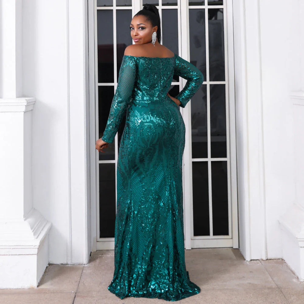 Woman in elegant plus-size dress featuring lace-like sequin patterns, long sleeves, and a flattering mermaid silhouette.